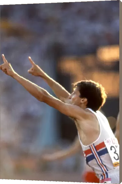 Seb Coe gestures to the press that he is no. 1 after retaining his 1500m Olympic title in Los Angeles in 1984
