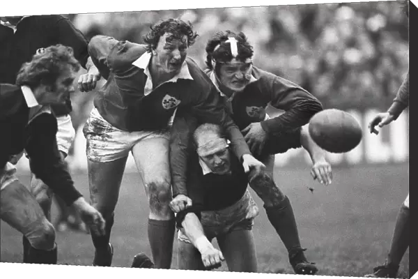 Irelands Willie Duggan and John O Driscoll sandwich Scotlands Mike Biggar - 1978 Five Nations