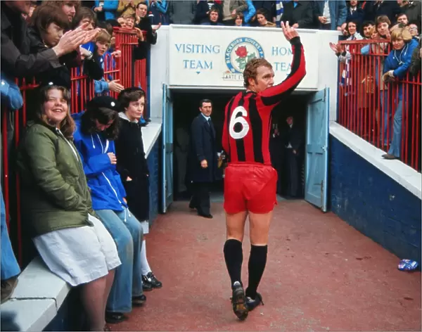 Bobby Moore waves to the crowd after playing his final league game