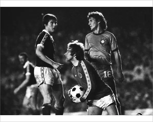 Scotland goalkeeper Alan Rough gather the ball frokm Brazils Zico in 1977