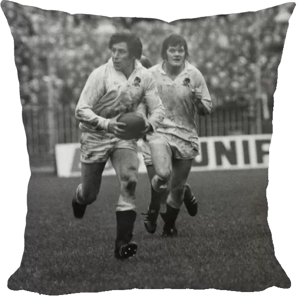 Englands John Pullin is supported by Fran Cotton - 1975 Five Nations