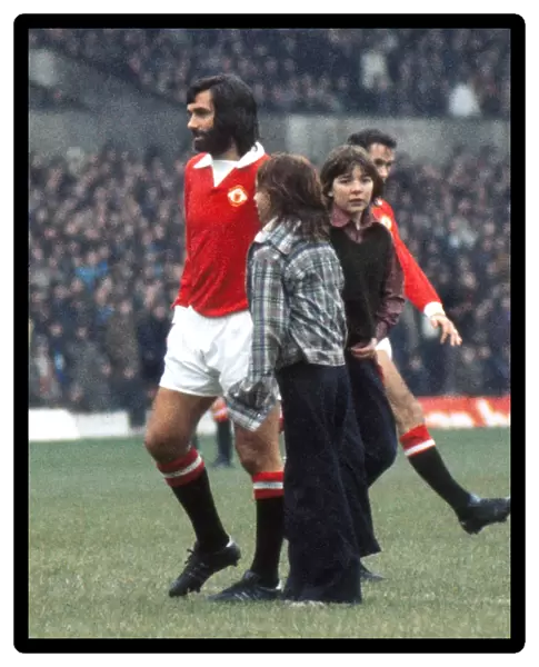 George Best is greeted by young fans before kick-off on his first team return for Manchester United in 1973