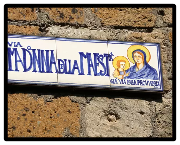 Street sign for the Via Madonna della Maesta in the hilltop village of Civita di Bagnoregio