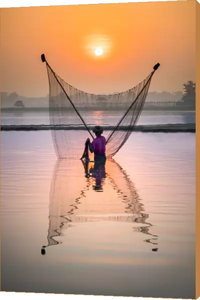 Fisherman fishing in the Taungthaman lake in Amarapura, Mandalay, Myanmar