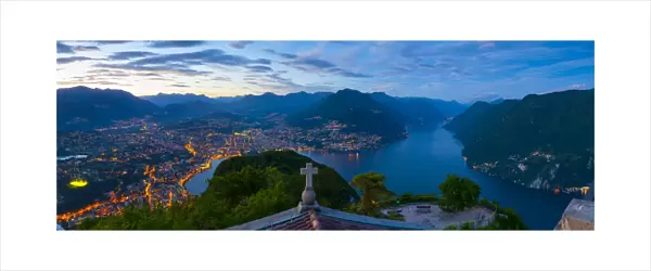 Elevated view over Lugano from Monte San Salvatore illuminated at Dusk, Lake Lugano
