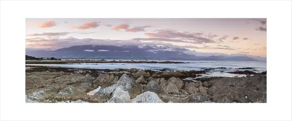 Rugged coastal landscape illuminated at sunset, Kaikoura, South Island, New Zealand
