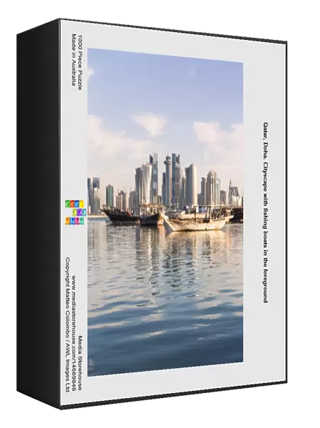 Qatar, Doha. Cityscape with fishing boats in the foreground