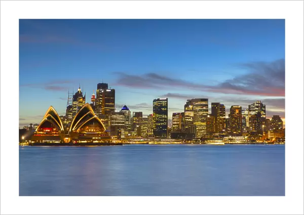 Sydney Opera House and skyline at sunset, Sydney, New South Wales, Australia