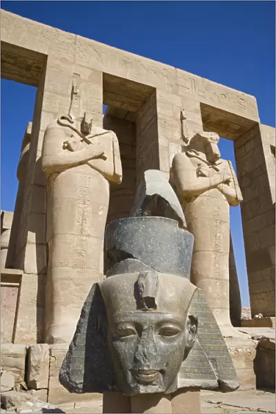 Headless statues of Ramses II line the courtyard at