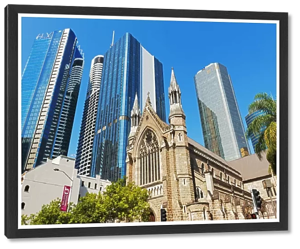 St Stephens Cathedral dwarfed by glass skyscrapers, Brisbane, Queensland, Australia