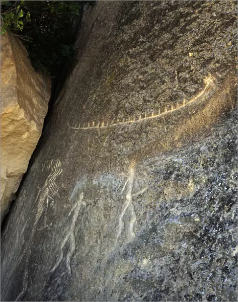 Men and a boat rock engravings. Gobustan Rock Art Cultural Landscape Reserve has an