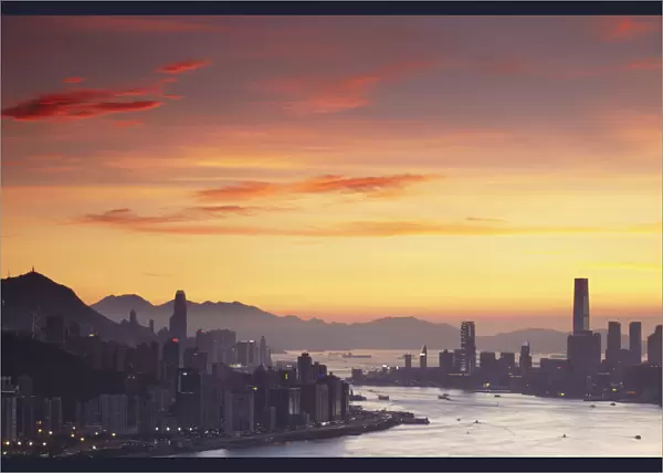 Hong Kong Island and Tsim Sha Tsui skylines at sunset, Hong Kong, China