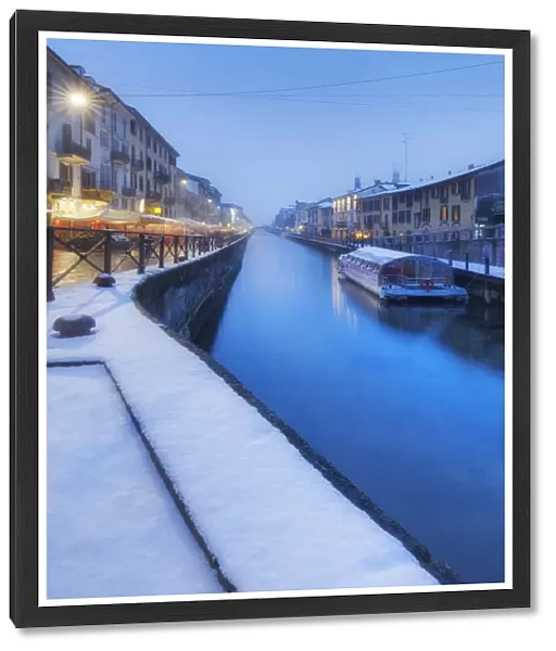 Naviglio Grande after a snowfall during dusk. Milan, Lombardy, Northern Italy, Italy