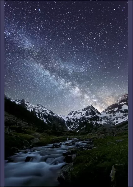 Milky way on a mountain, with a little river in the middle of the valley, Marittime Alps