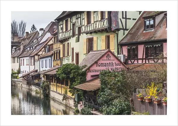 Canal waterfront view of traditional townhouses, Colmar, Grand Est, France