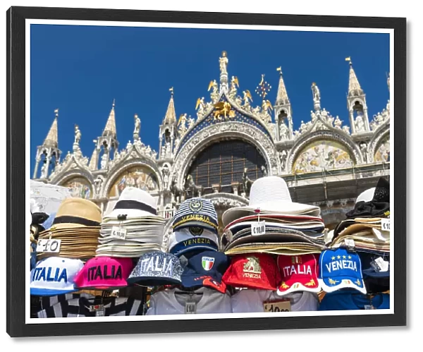 Venetian souvenirs with St Marks Basilica in the background. Venice, Veneto