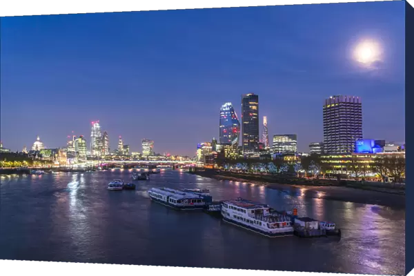 Full moon over St Pauls Cathedral, Blackfriars Bridge and financial district