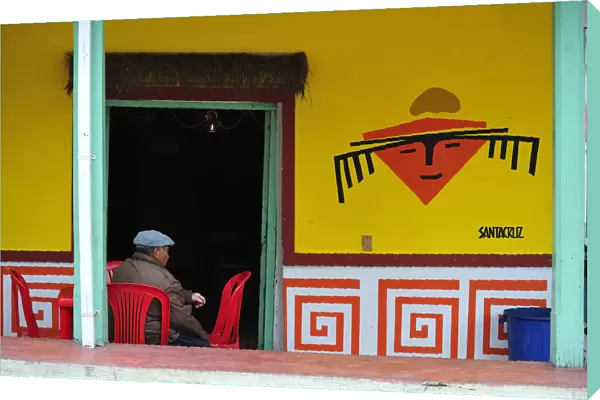 Old man sat at an outdoor cafe in Las Lajas, Colombia, South America