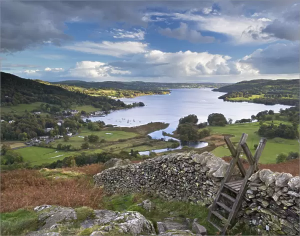 Footpath stile over dry stone wall, overlooking Lake Windermere, Lake District, Cumbria
