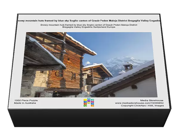 Snowy mountain huts framed by blue sky Soglio canton of Graub√ºnden Maloja District Bregaglia Valley Engadine Switzerland Europe
