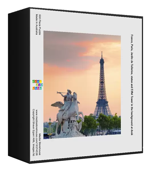 France, Paris, Jardin de Tuileries, statue and Eiffel Tower in the background at dusk