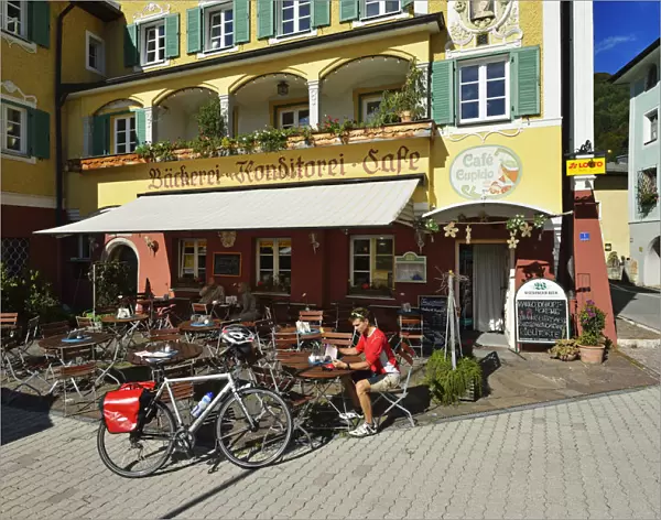 Cyclists paused outside the cafe Cupid Marktschellenberg, Berchtesgaden, Upper Bavaria