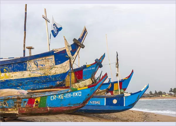 Africa, Ghana, Elmina and surroundings. Traditional fishing boats on the beach in
