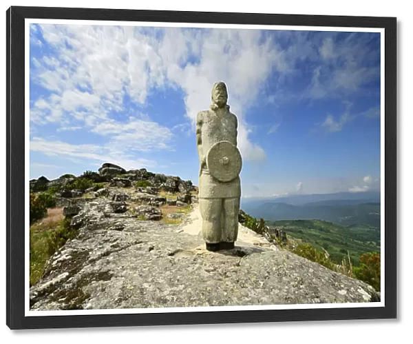 A galician-lusitanian warrior watch the horizon on the top of the Iron Age settlement