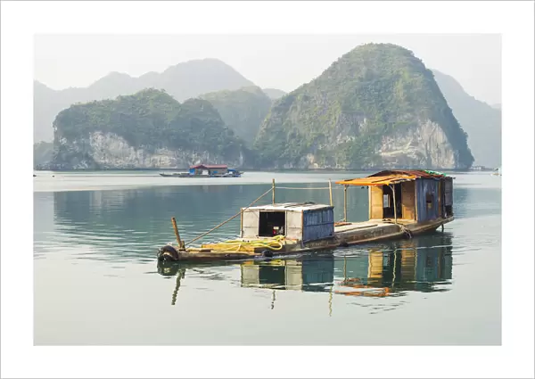 Lan ha bay, Halong arcipelago, Vietnam. Cargo floating boat