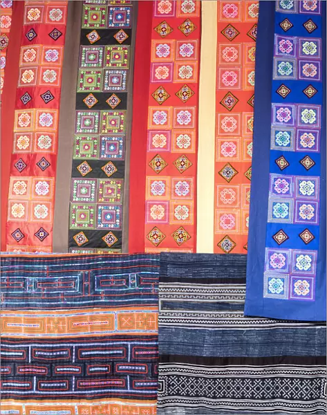 Colourful fabrics hanging in a market, Sapa; Sa Pa District; Lao Cai Province; Vietnam