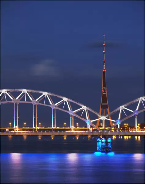 Railway bridge across Daugava River with TV tower in background, Riga, Latvia