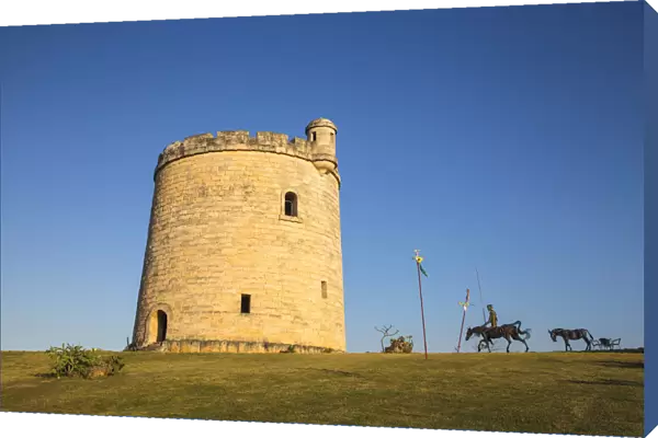 Cuba, Varadero, Stone tower and metal statue of Don Quixote on horseback near the
