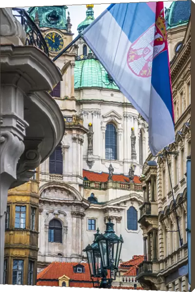 Czech Republic, Prague, Mala Strana, St. Nicholas Church between buildings on Malostranske