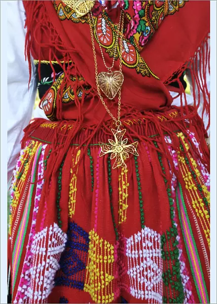 Gold necklace and traditional costume (Lavradeira) of Minho