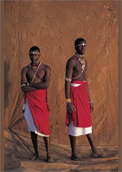 Samburu warriors, infront of muddy backdrop at Sunset, Laikipia Kenya