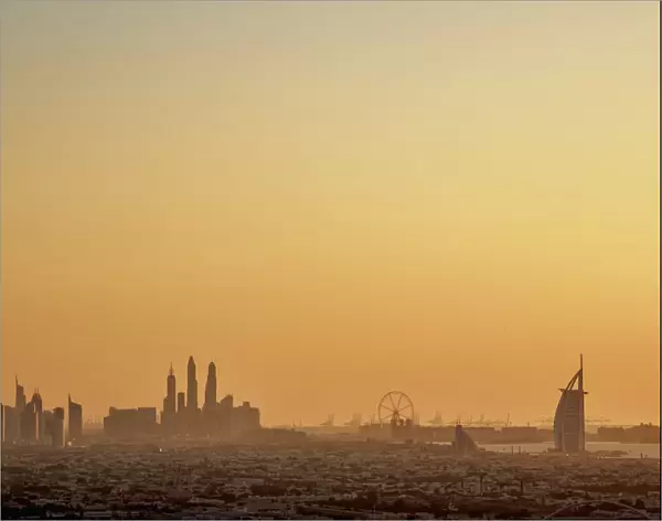 Elevated view towards Dubai Marina and Burj Al Arab Hotel at sunset, Dubai, United