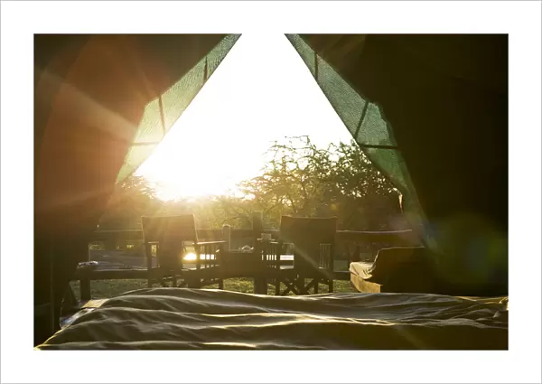 Sun rises into safari tent, from the bed, Tanzania