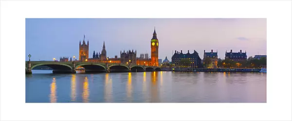 The Houses of Parliament & The River Thames illuminated at dusk