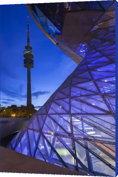 Germany, Bavaria, Munich, BMW Welt company showroom and Olympia Tower, dusk