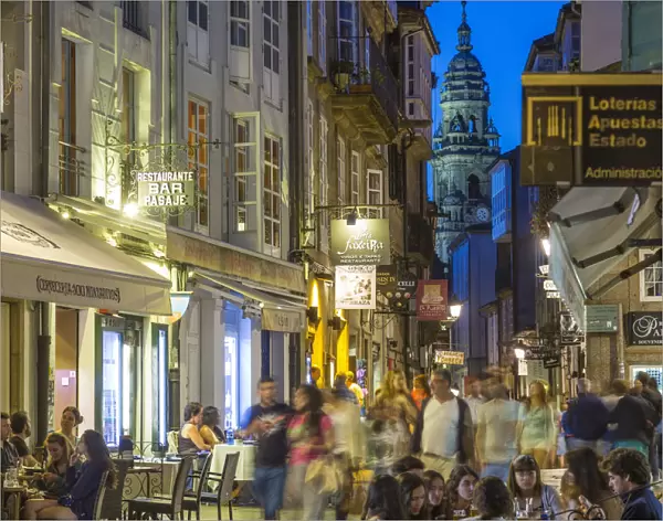 Busy central street with restaurants in the evening Santiago de Compestela, Galicia