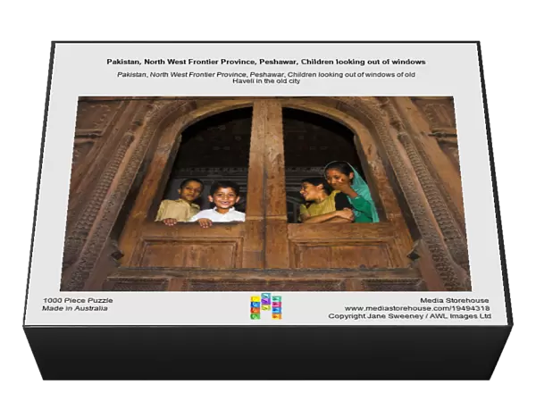 Pakistan, North West Frontier Province, Peshawar, Children looking out of windows