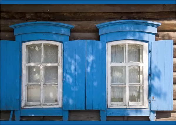 Russia, Irkutsk, Wooden house with blue shuttters