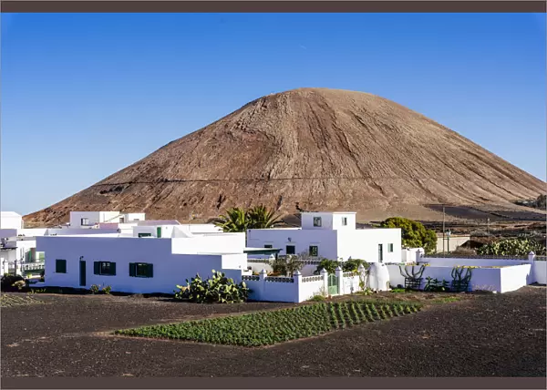 Village and Volcano in rural area of La Geria, Lanzarote, Canary Islands, Spain