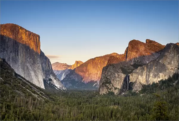 Scenic view of forest in valley amidst rocky mountains at Tunnel View