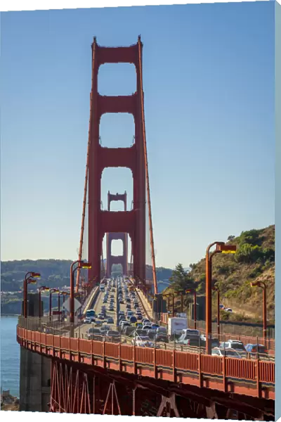 Traffic on famous Golden Gate Bridge against clear sky, San Francisco