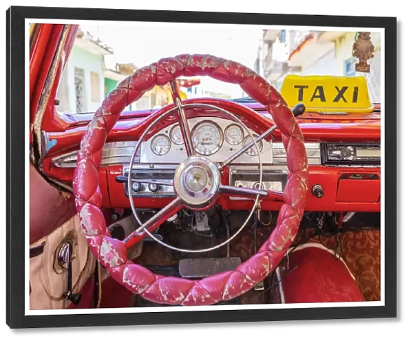 Steering wheel and dashboard in a classic car in Trinidad, Sancti Spiritus, Cuba
