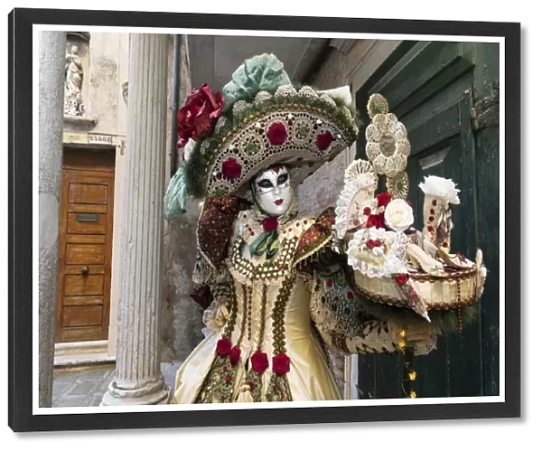 A woman in a beautiful costume poses during the Venice Carnival, Venice; Veneto; Italy