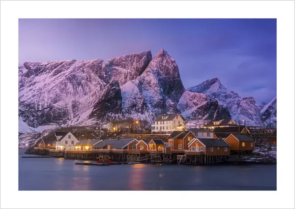 Fishermens cabins (rorbuer) of Sakrisoy along the coast at sunrise in the Lofoten