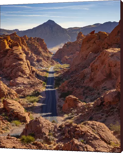 Straight road between red rocks during sunny day, Valley of Fire State Park, Nevada