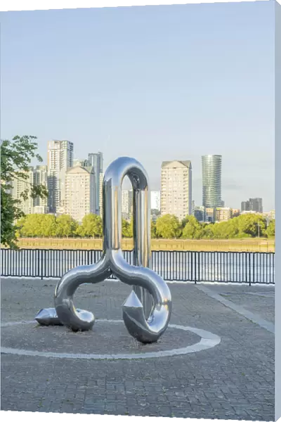 Curlicue sculpture by William Pye and Canary Wharf and the River Thames, London, England